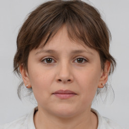 Neutral white young-adult female with medium  brown hair and brown eyes