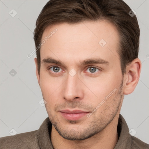 Neutral white young-adult male with short  brown hair and brown eyes