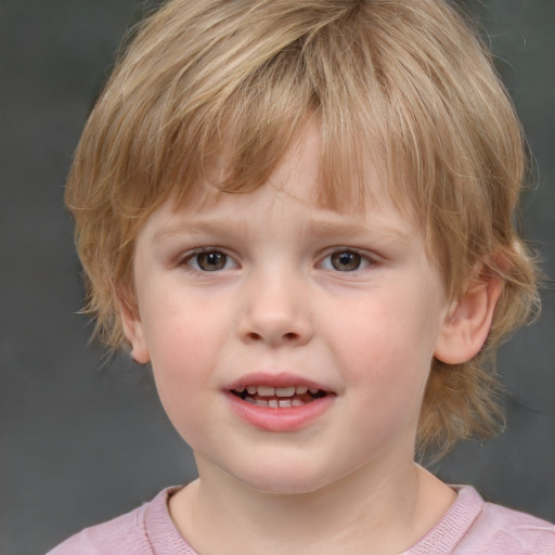 Joyful white child male with short  brown hair and grey eyes