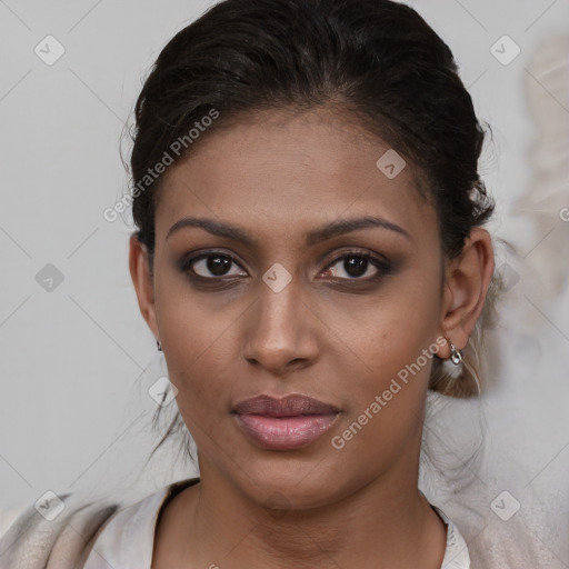 Joyful latino young-adult female with medium  brown hair and brown eyes