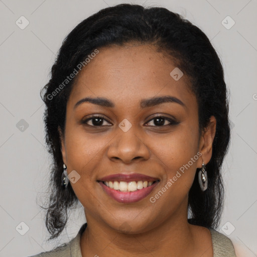 Joyful black young-adult female with long  black hair and brown eyes