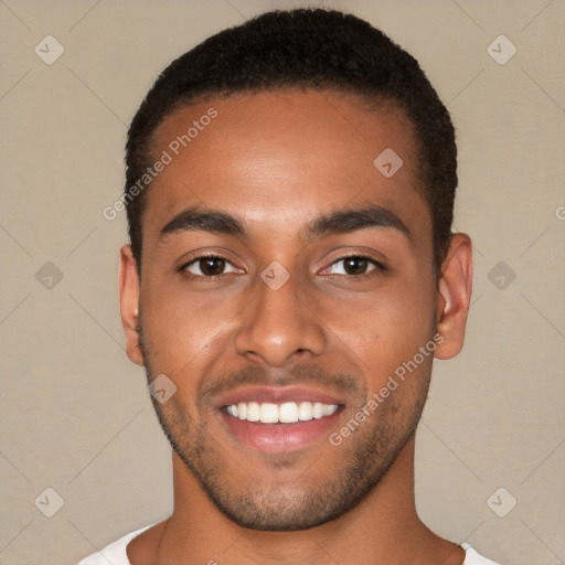 Joyful white young-adult male with short  black hair and brown eyes