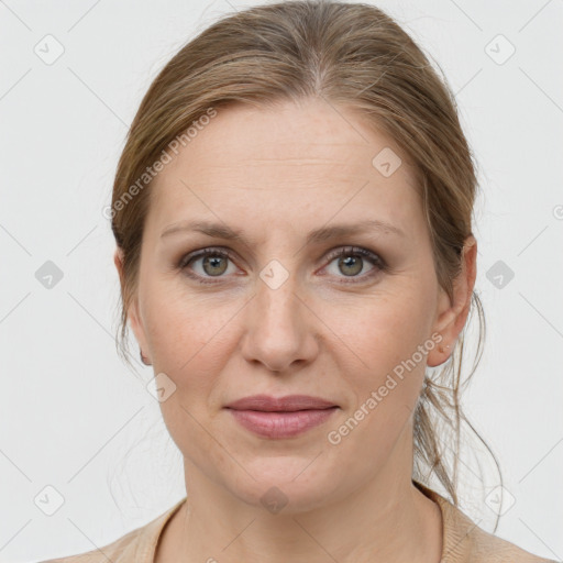 Joyful white adult female with medium  brown hair and grey eyes