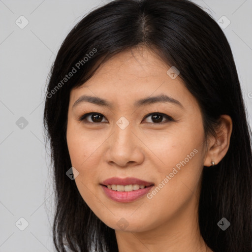 Joyful asian young-adult female with long  brown hair and brown eyes