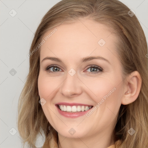 Joyful white young-adult female with long  brown hair and blue eyes