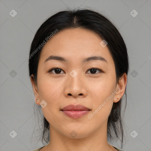 Joyful asian young-adult female with medium  black hair and brown eyes