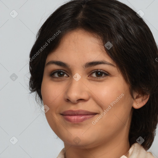 Joyful latino young-adult female with medium  brown hair and brown eyes