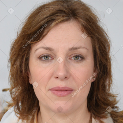 Joyful white adult female with medium  brown hair and grey eyes