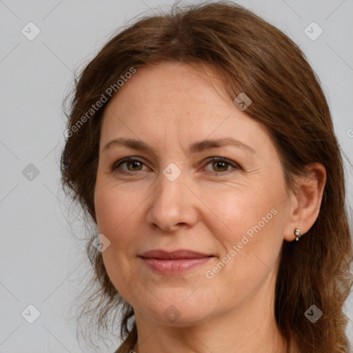 Joyful white adult female with medium  brown hair and brown eyes