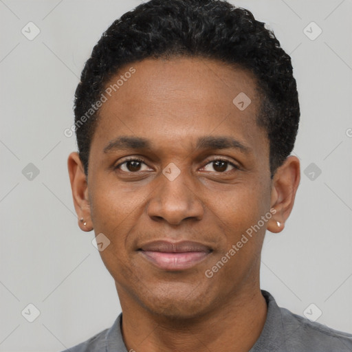 Joyful black young-adult male with short  black hair and brown eyes