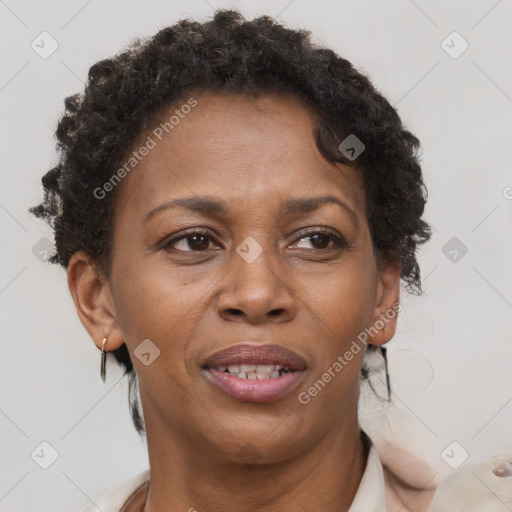 Joyful black adult female with short  brown hair and brown eyes