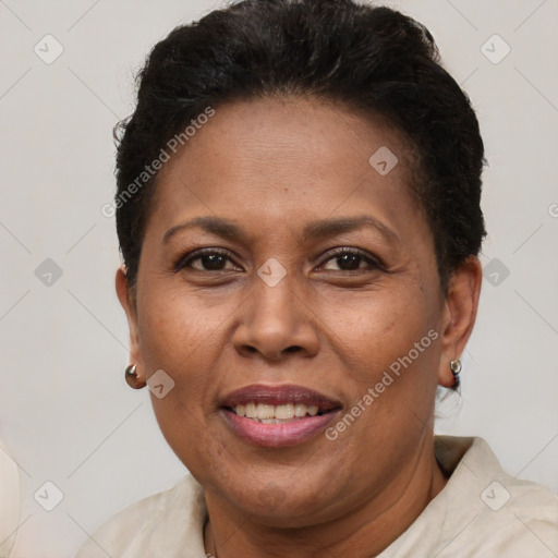 Joyful latino adult female with short  brown hair and brown eyes