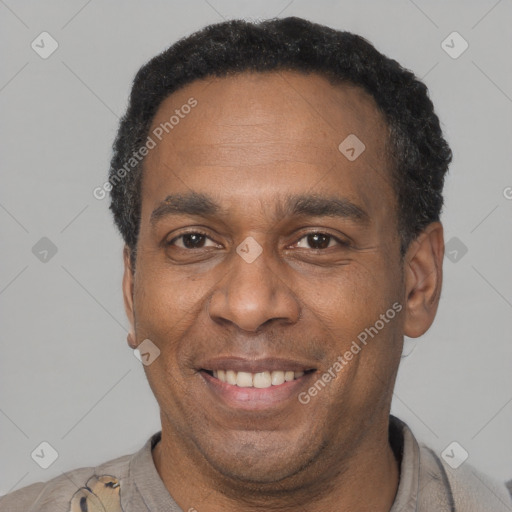 Joyful latino adult male with short  brown hair and brown eyes