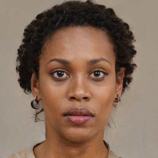 Neutral black young-adult female with short  brown hair and brown eyes