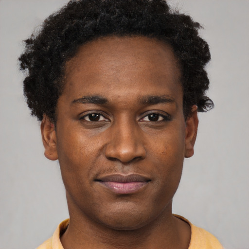 Neutral black young-adult male with short  black hair and brown eyes