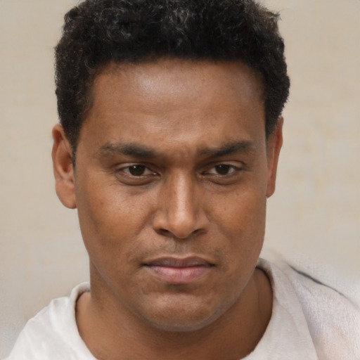 Neutral latino young-adult male with short  brown hair and brown eyes
