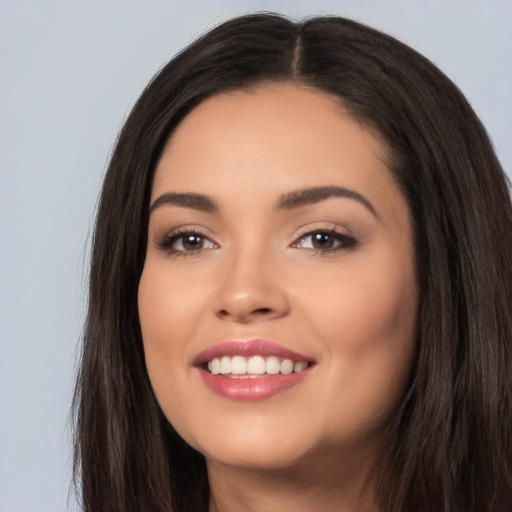 Joyful white young-adult female with long  black hair and brown eyes