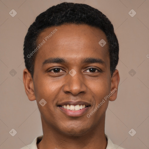 Joyful black young-adult male with short  black hair and brown eyes