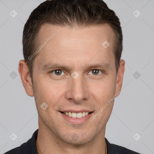 Joyful white adult male with short  brown hair and brown eyes