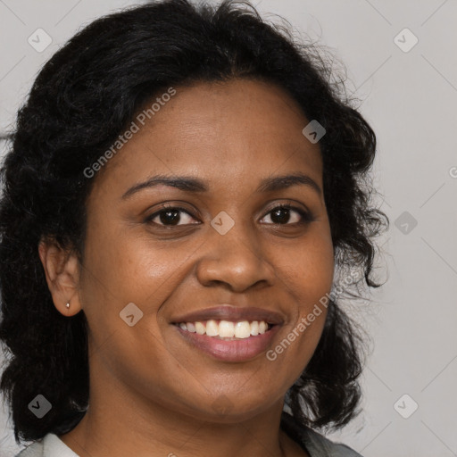 Joyful black young-adult female with long  brown hair and brown eyes