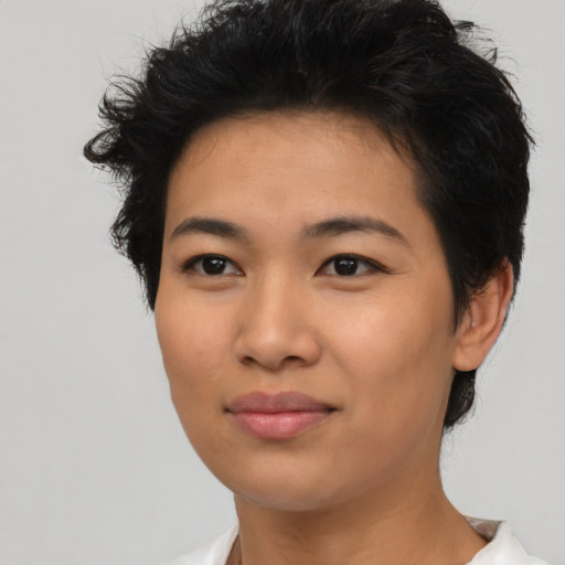 Joyful asian young-adult female with short  black hair and brown eyes