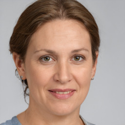 Joyful white adult female with medium  brown hair and grey eyes