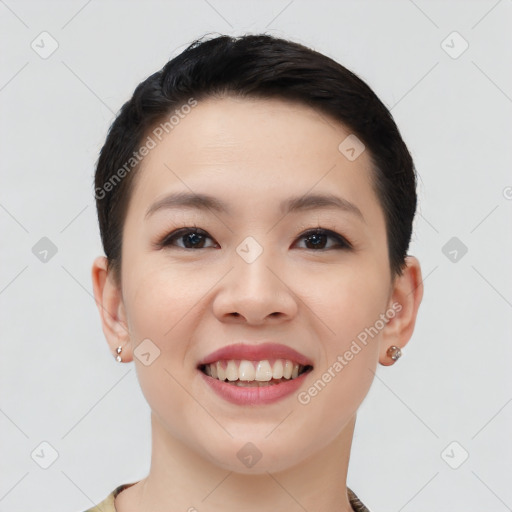 Joyful asian young-adult female with short  black hair and brown eyes