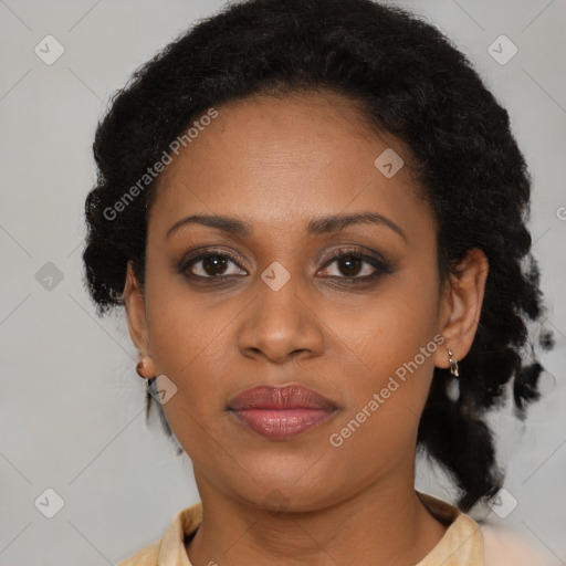 Joyful black young-adult female with medium  brown hair and brown eyes