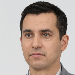 Neutral white adult male with short  black hair and brown eyes