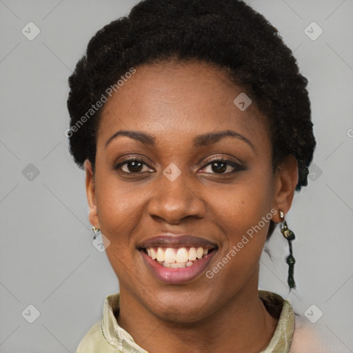 Joyful black young-adult female with short  black hair and brown eyes