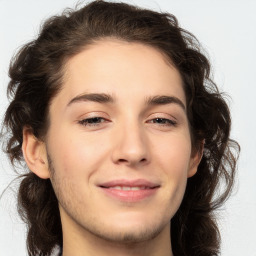 Joyful white young-adult male with medium  brown hair and brown eyes