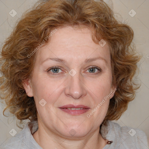 Joyful white adult female with medium  brown hair and blue eyes