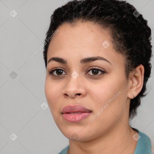 Joyful latino young-adult female with short  black hair and brown eyes