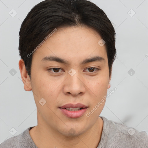 Joyful asian young-adult male with short  brown hair and brown eyes