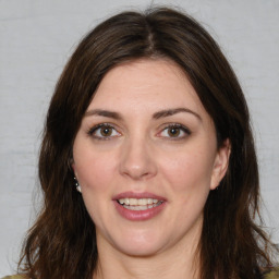 Joyful white adult female with medium  brown hair and brown eyes