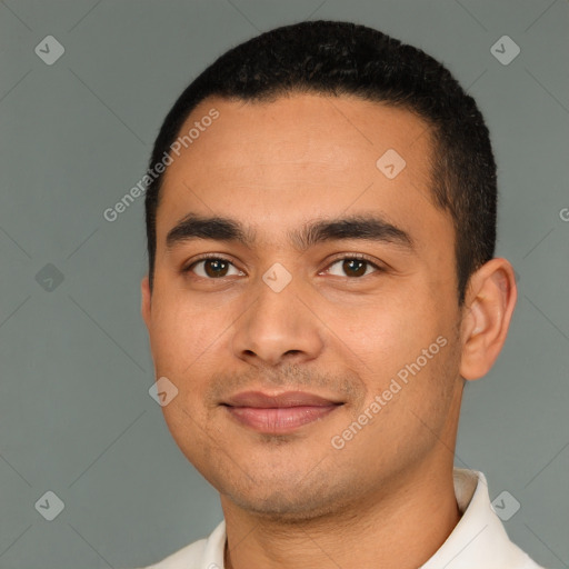 Joyful latino young-adult male with short  black hair and brown eyes