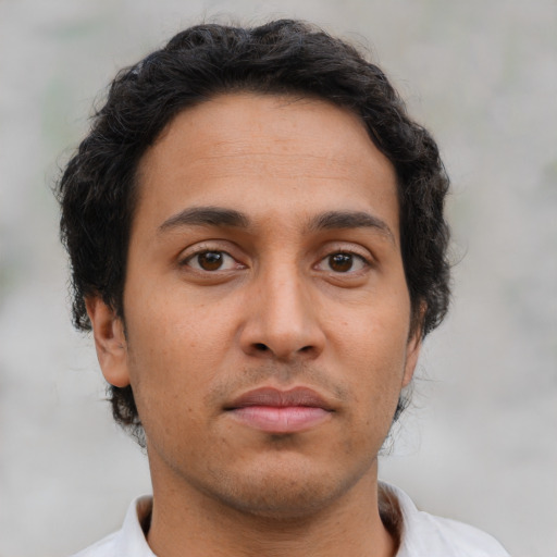 Neutral latino young-adult male with short  brown hair and brown eyes
