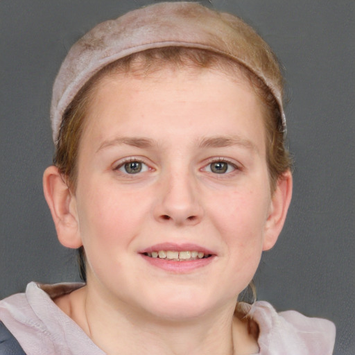 Joyful white young-adult female with short  brown hair and blue eyes
