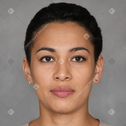 Joyful latino young-adult female with short  black hair and brown eyes