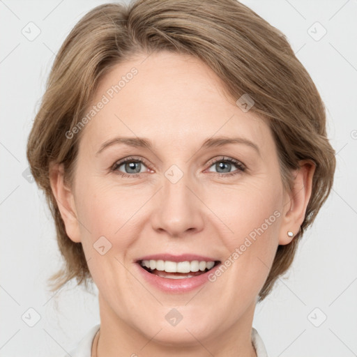 Joyful white adult female with medium  brown hair and grey eyes