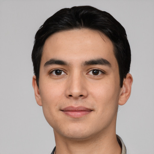 Joyful asian young-adult male with short  black hair and brown eyes