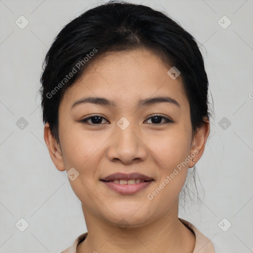 Joyful latino young-adult female with short  black hair and brown eyes