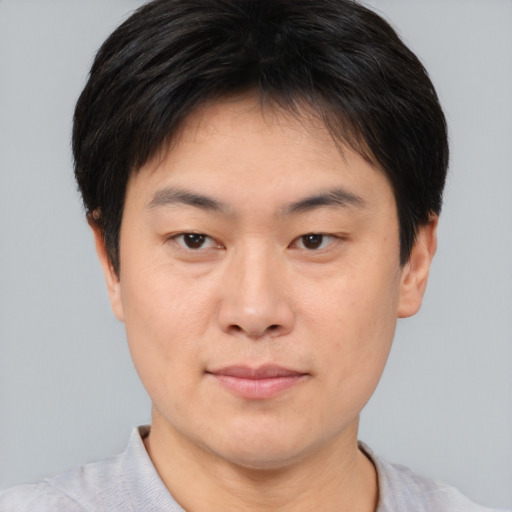 Neutral asian young-adult male with short  brown hair and brown eyes
