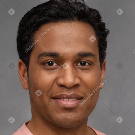 Joyful latino young-adult male with short  brown hair and brown eyes