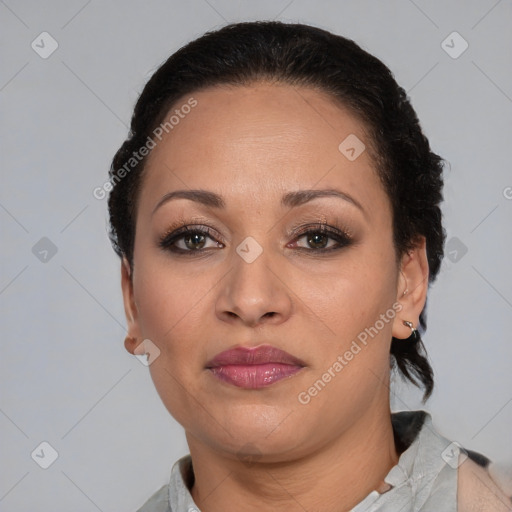 Joyful latino adult female with short  brown hair and brown eyes