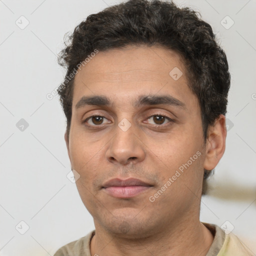 Neutral white young-adult male with short  black hair and brown eyes
