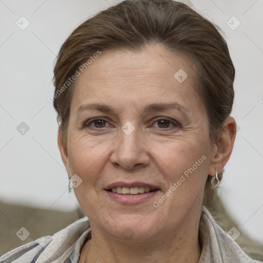 Joyful white adult female with short  brown hair and brown eyes