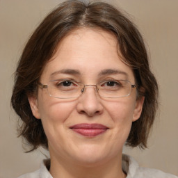 Joyful white adult female with medium  brown hair and brown eyes