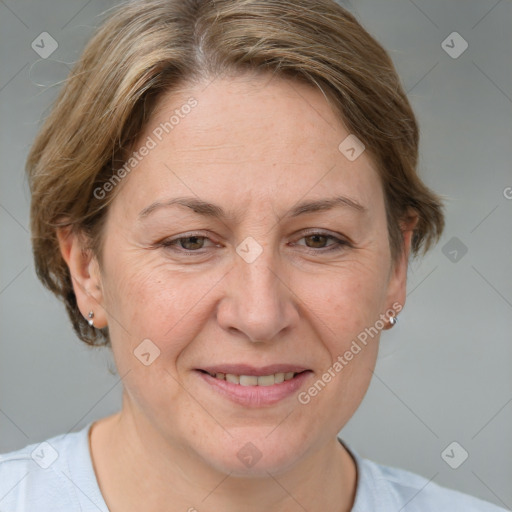 Joyful white adult female with medium  brown hair and grey eyes