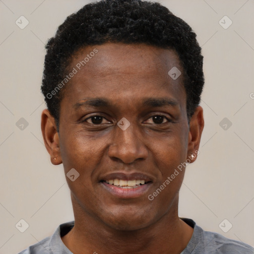 Joyful black young-adult male with short  black hair and brown eyes